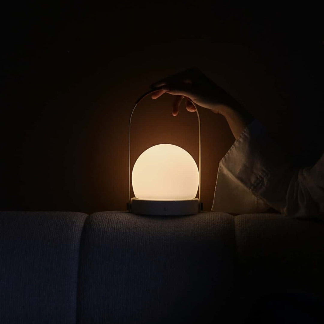 audo copenhagen (menu) | carrie portable table lamp | bronzed brass + leather strap