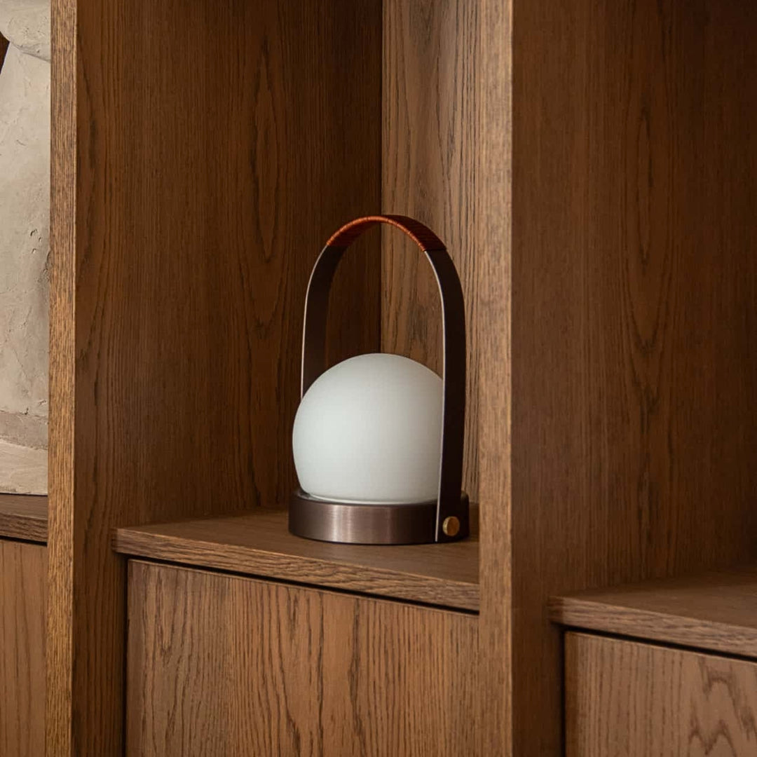 audo copenhagen (menu) | carrie portable table lamp | bronzed brass + leather strap