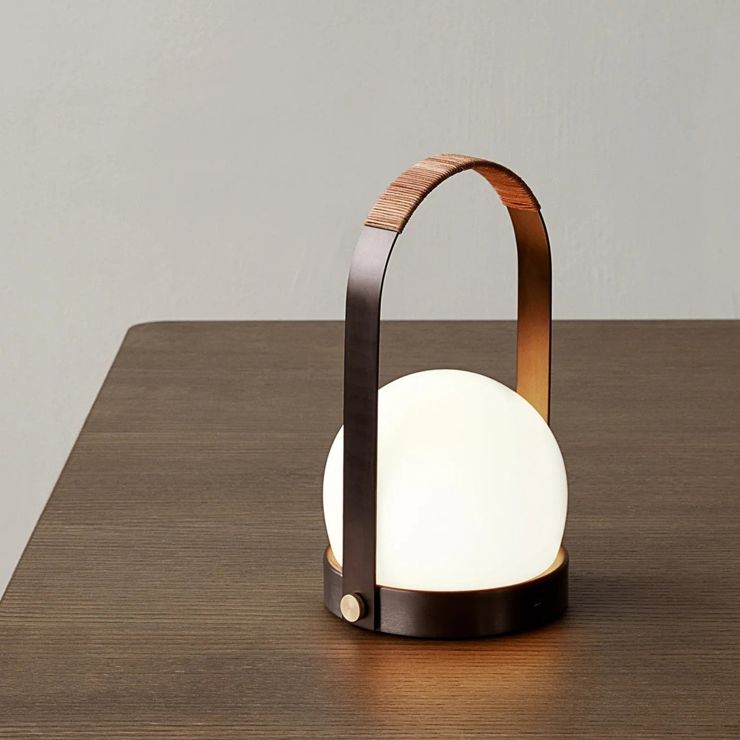 audo copenhagen (menu) | carrie portable table lamp | bronzed brass + leather strap