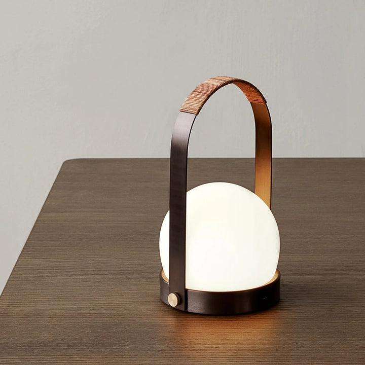 audo copenhagen (menu) | carrie portable table lamp | bronzed brass + leather strap