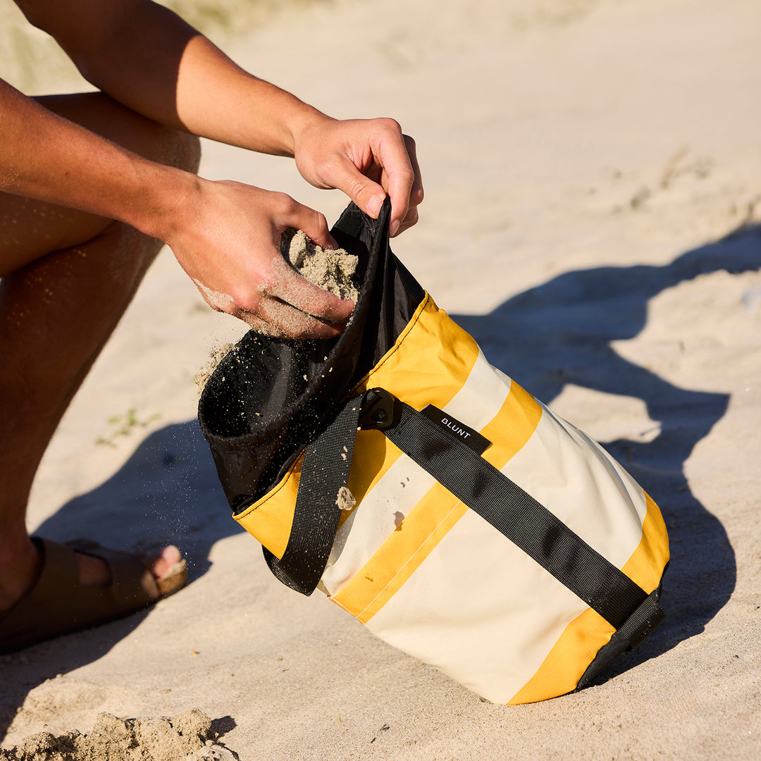 blunt | beach umbrella | sand