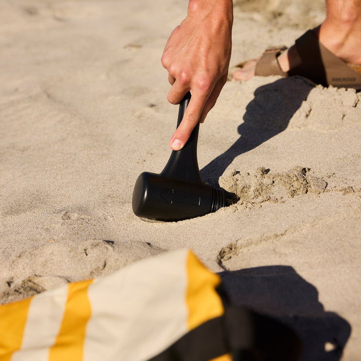 blunt | beach umbrella | sand