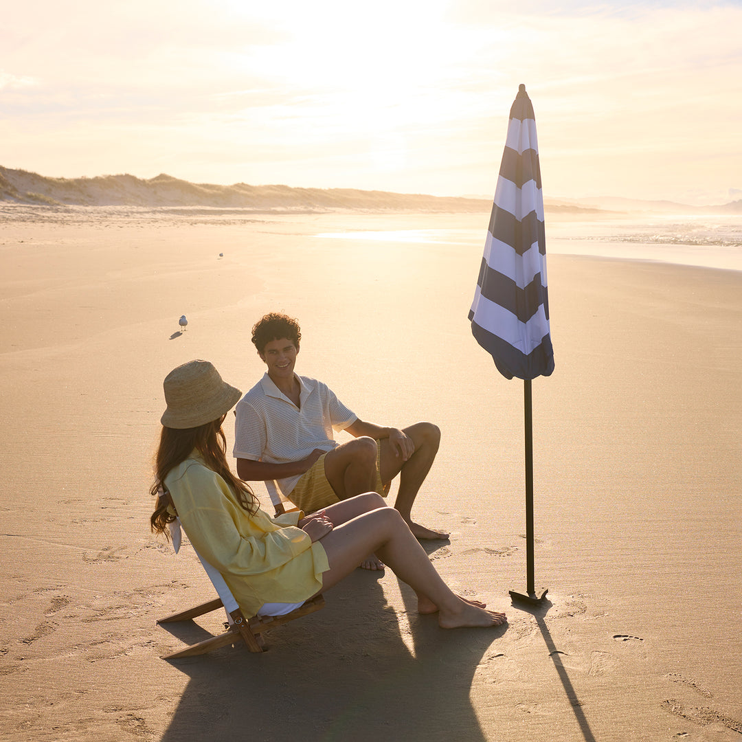blunt | beach umbrella | sea