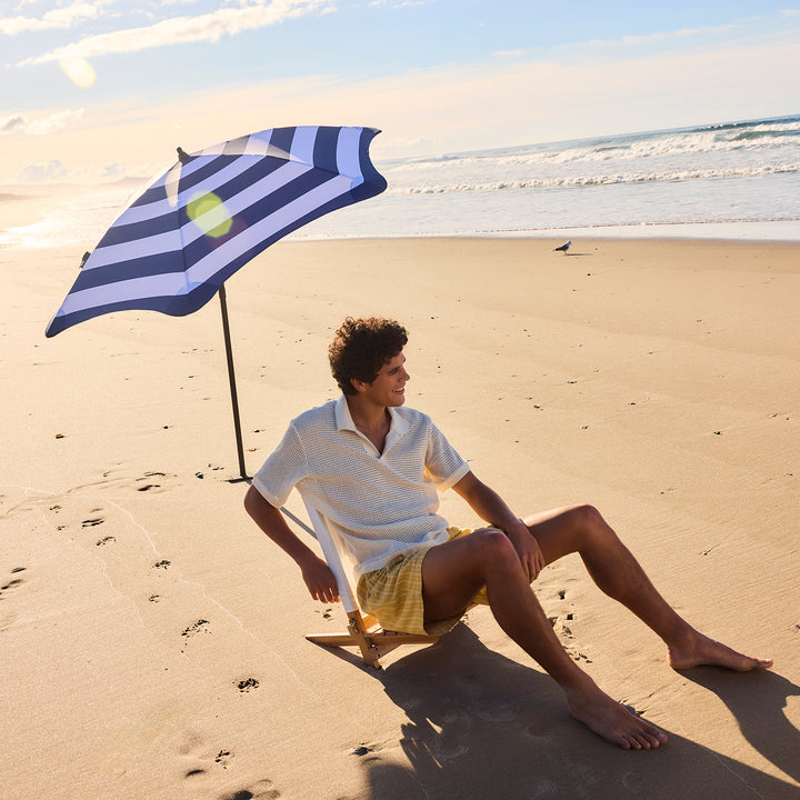 blunt | beach umbrella | sea