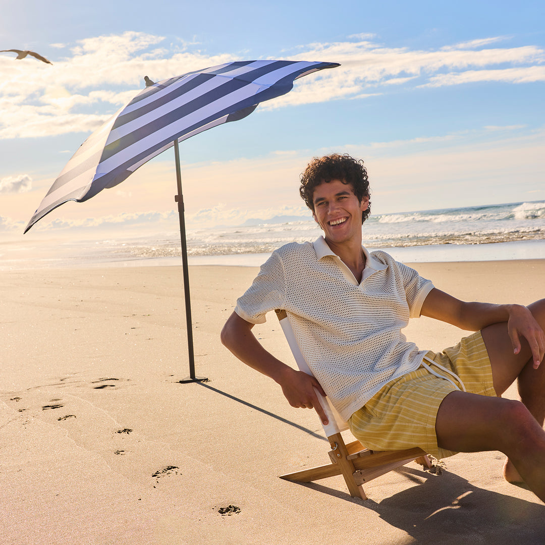 blunt | beach umbrella | sea