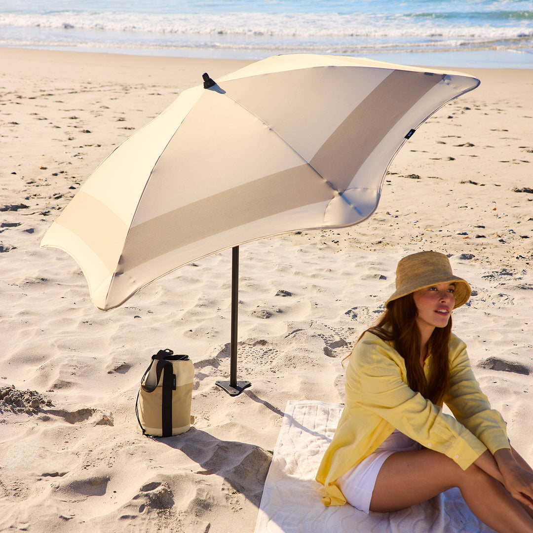 blunt | beach umbrella | sand