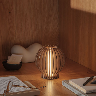 eva solo | radiant round portable table lamp | smoked oak