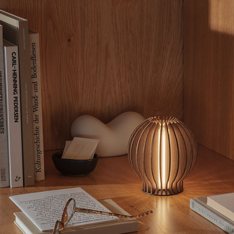 eva solo | radiant round portable table lamp | smoked oak