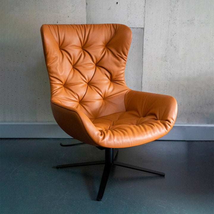freifrau | leya wingback chair | x-base frame with tilt | cairo cognac leather + chesterfield stitch