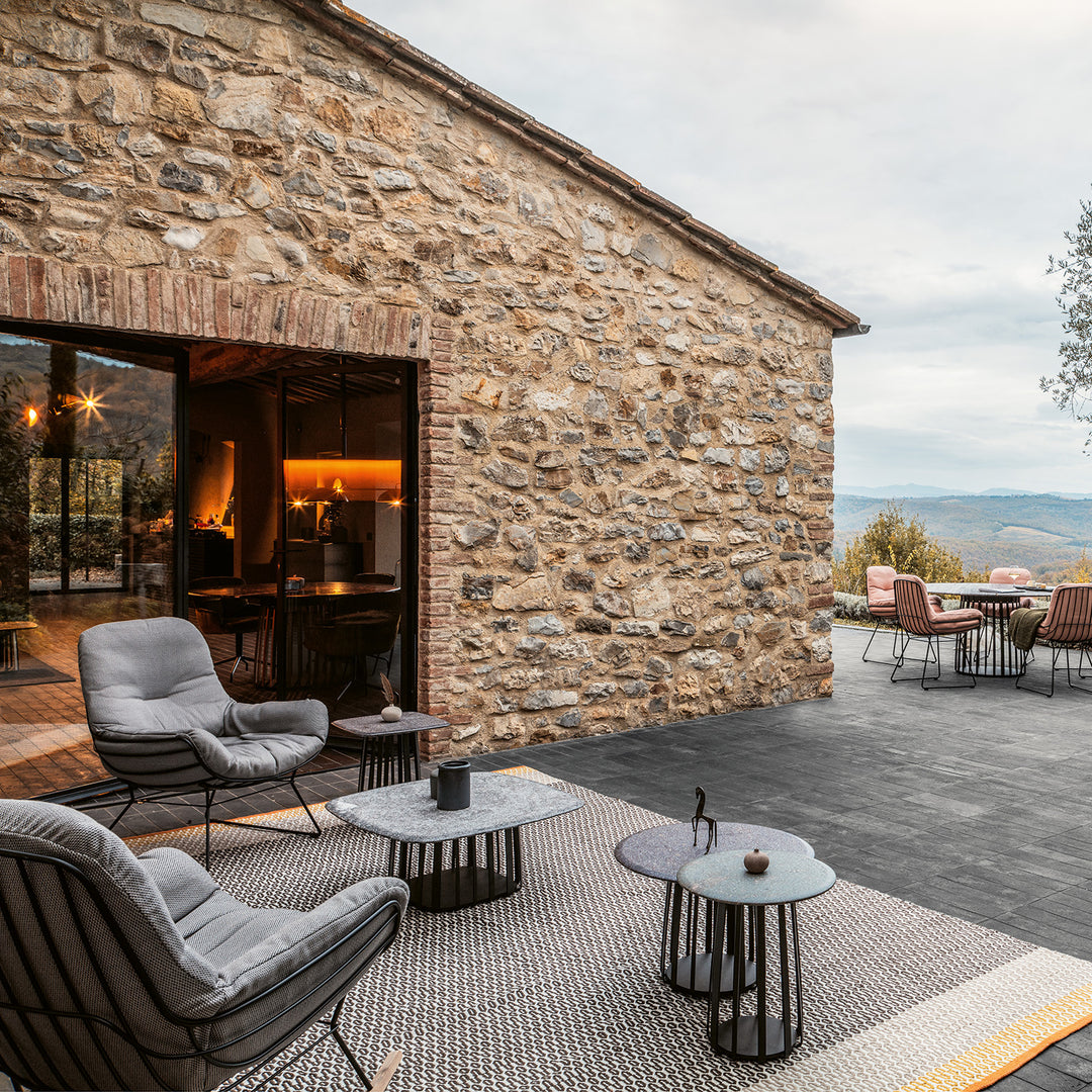 janua | bc 09 basket outdoor coffee table | travertine titanium stone + black base